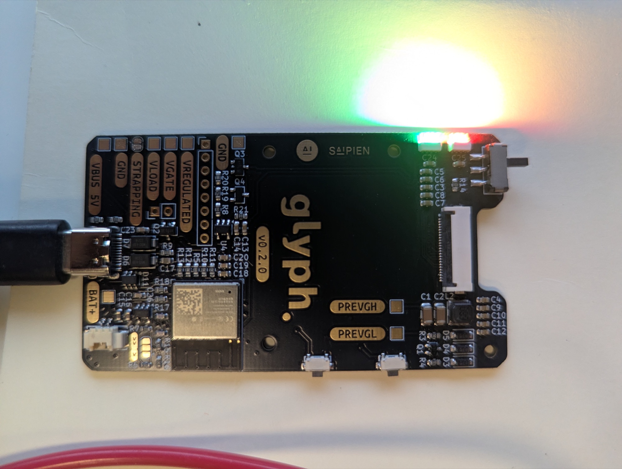 The assembled Glyph v2 board with status LEDs lit